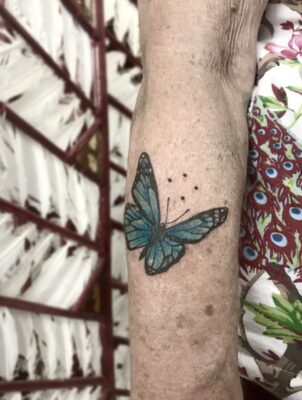 butterfly tattoo, oma tattoeage, oma, light art tattoo, women tattooer
