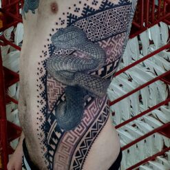 Izhar Rott Tattoo, snake tattoo, sacred geometry, rib tattoo